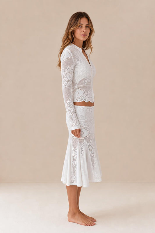 Side profile view of white crochet lace two-piece outfit