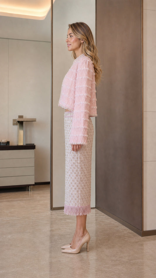 Model wearing pink tweed set side view