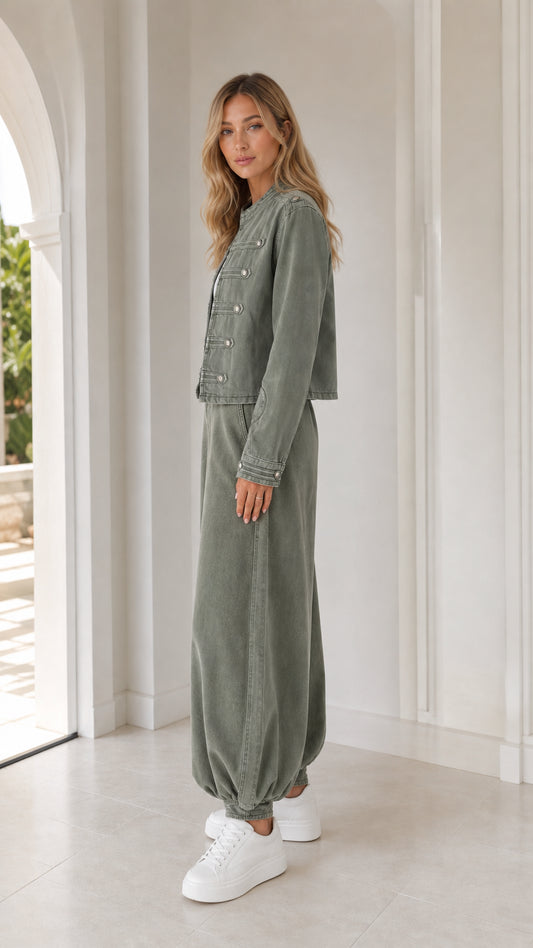 Side profile view of woman in sage green two-piece outfit
