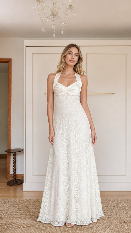 Front view of model wearing White halter neck lace maxi dress