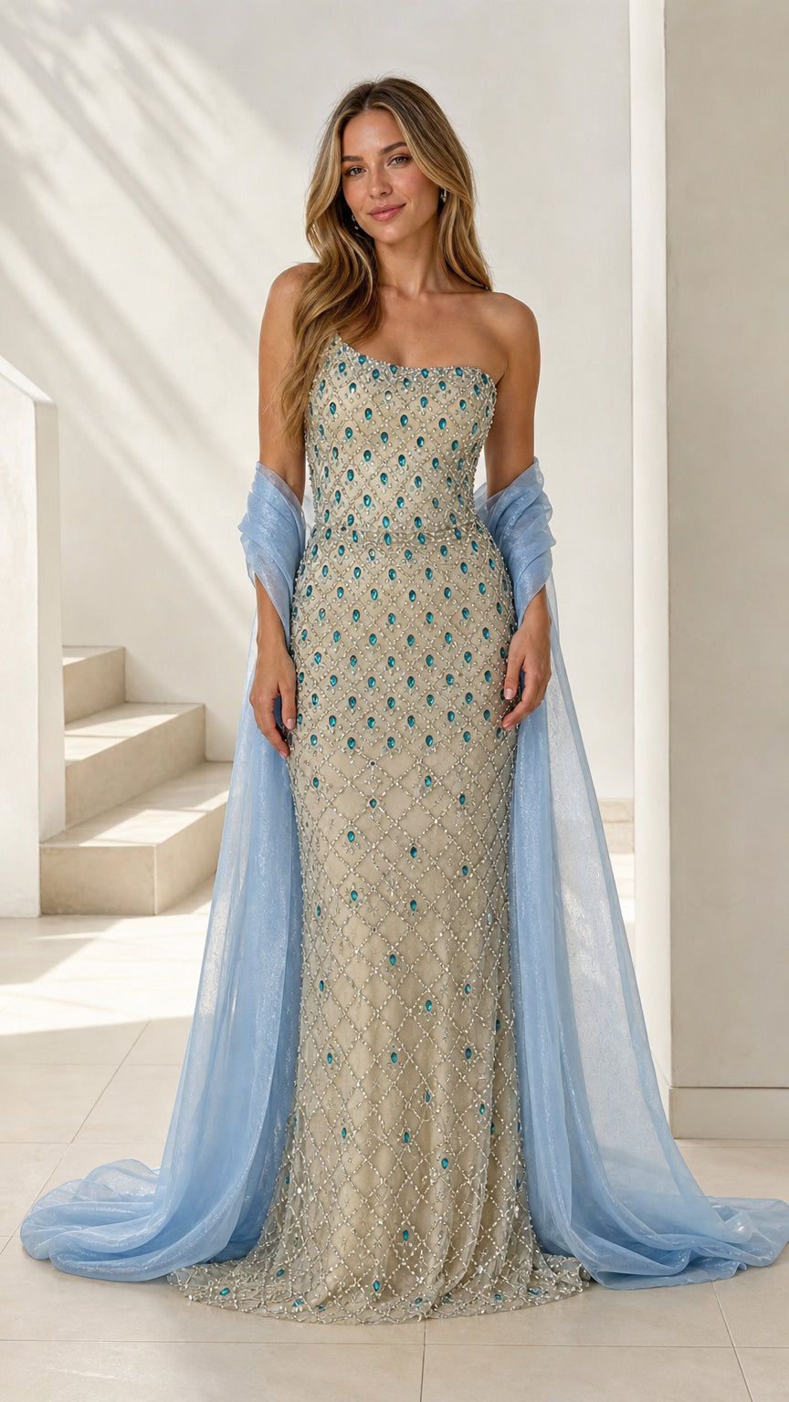Front view of champagne one-shoulder beaded evening gown with light blue stole