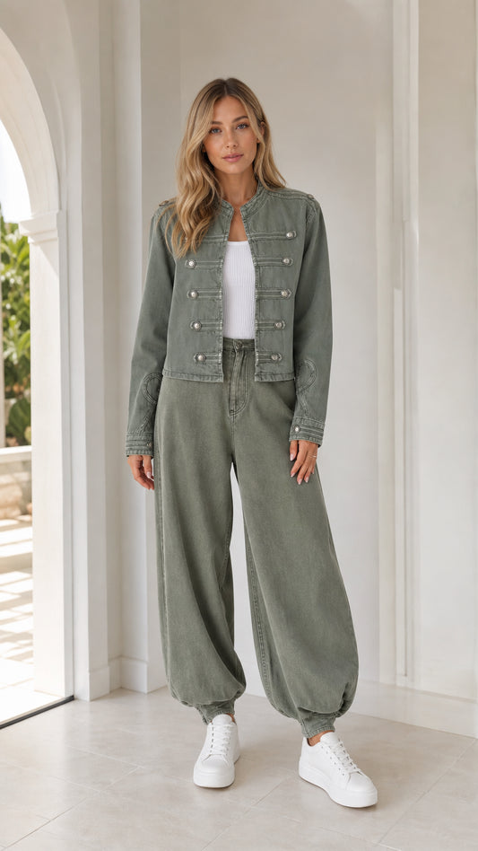 Front full view of woman wearing sage green utility jacket and matching balloon pants