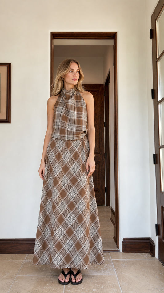 Front view of woman wearing brown plaid halter top and maxi skirt set