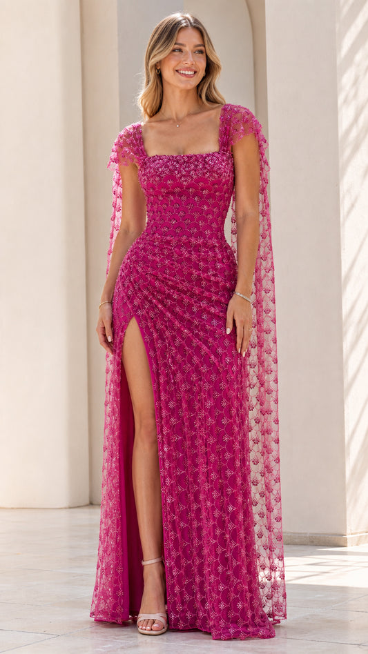 Front view of fuchsia sequin formal dress with cape
