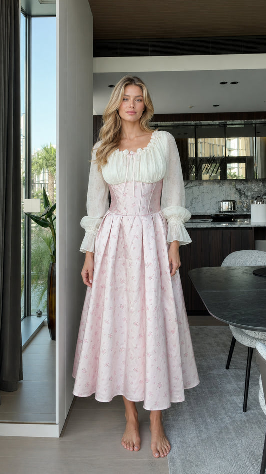 Full front view of model wearing pink vintage corset midi dress