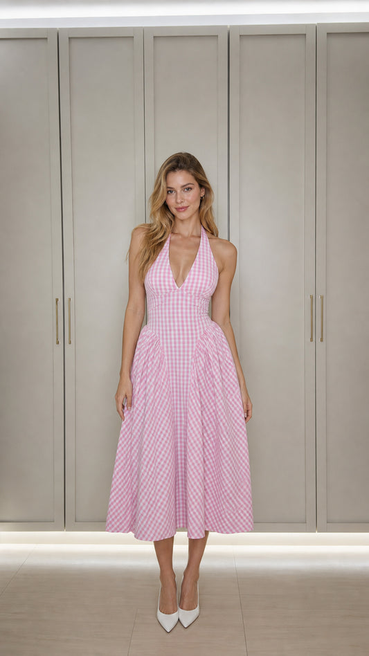 Front view of model wearing pink gingham halter midi dress