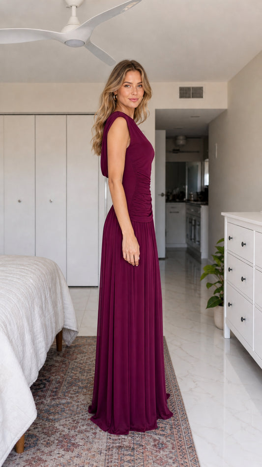 Side profile view of burgundy evening dress