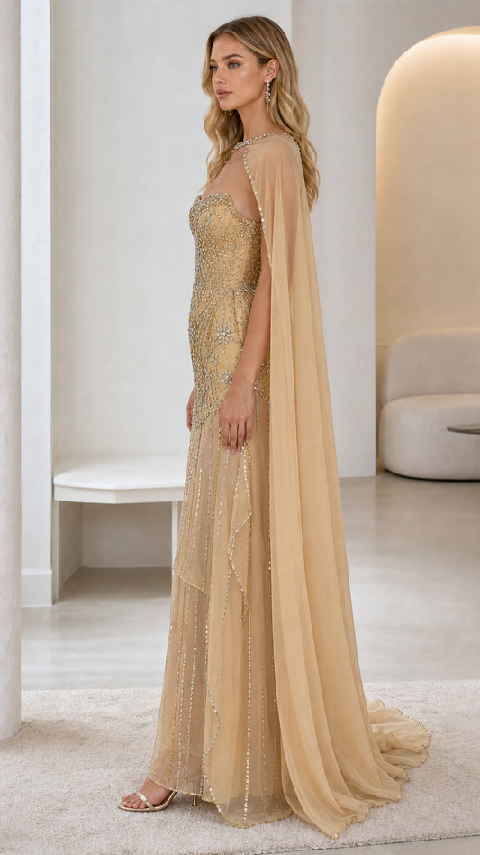 Side profile of gold evening gown showing cape length