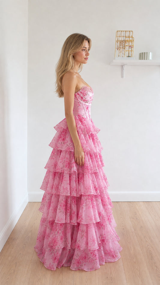 Side view of pink floral ruffle gown