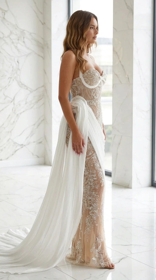 Side profile of model in nude beaded evening dress with flowing train