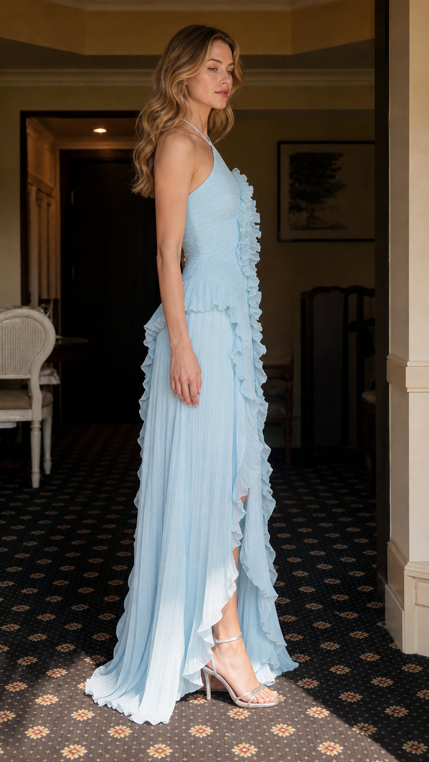 Side profile of model in light blue pleated maxi dress