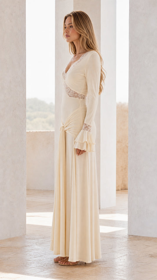 Side profile view of ivory maxi dress with knot detail