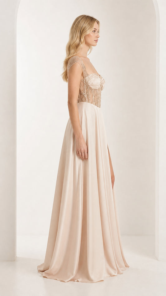 Side profile of champagne evening dress with thigh split