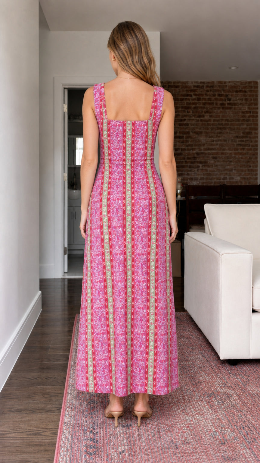 Back view of model wearing pink printed smocked maxi dress