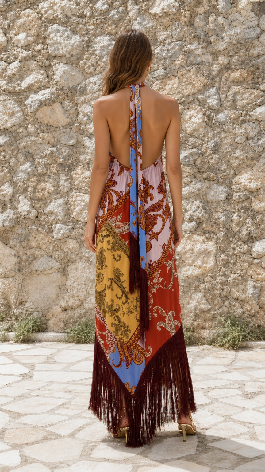 Back view of model wearing Multicolor paisley halter fringe maxi dress