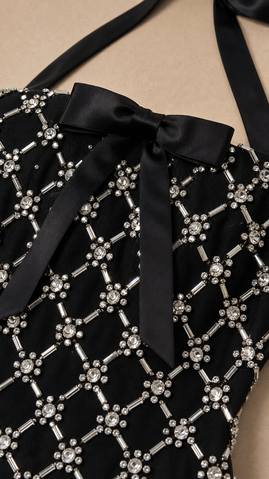 Close-up of rhinestone lattice pattern and satin bow