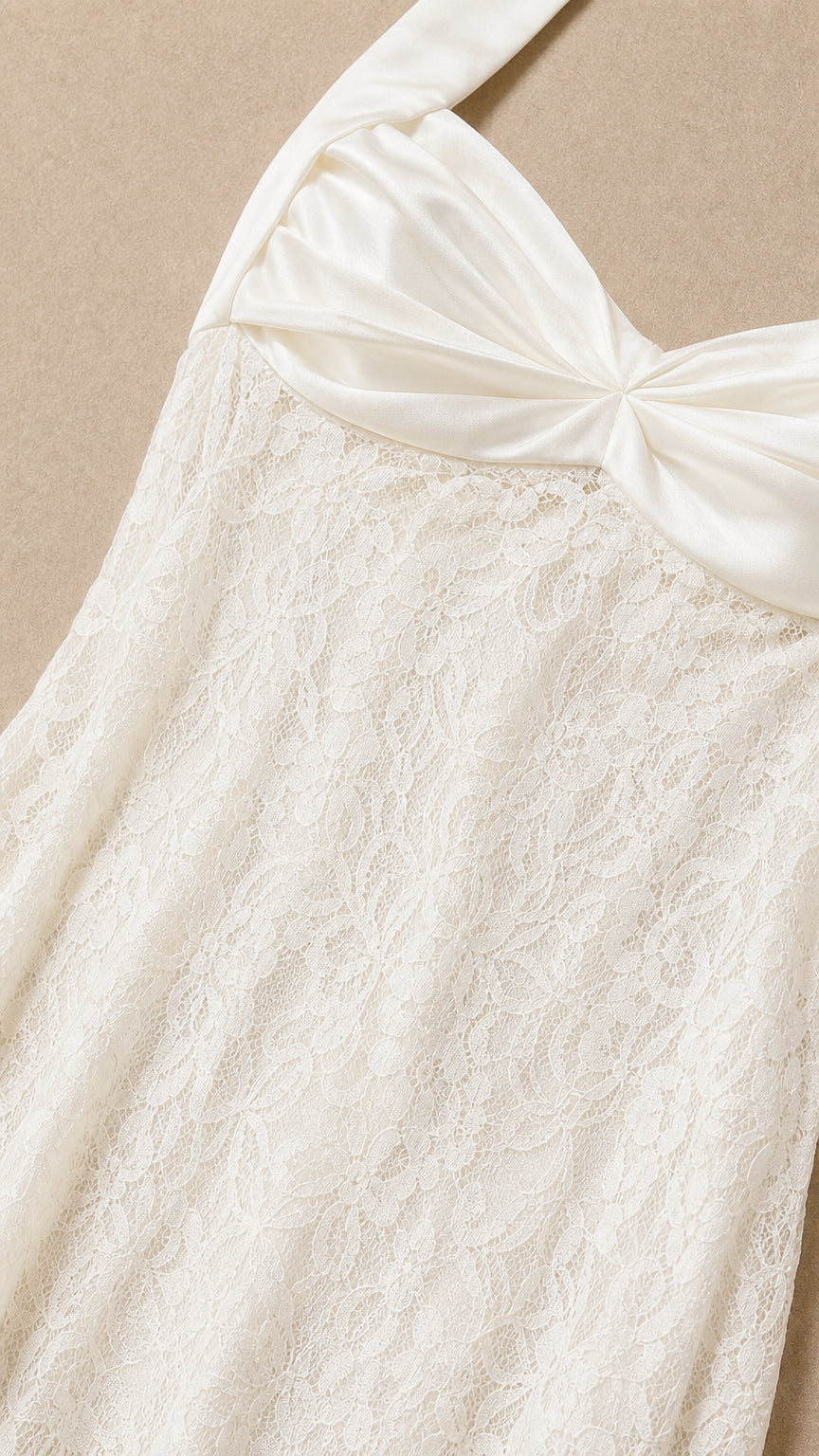 Close-up detail of satin bodice and floral lace on White dress
