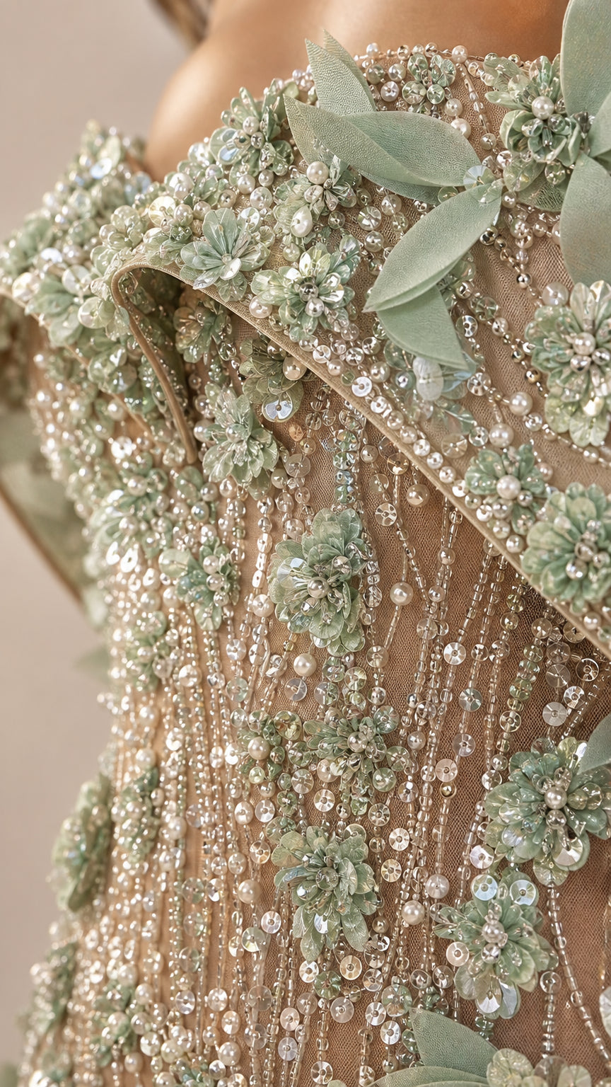 Close-up detail of beaded bodice and 3d floral appliqués