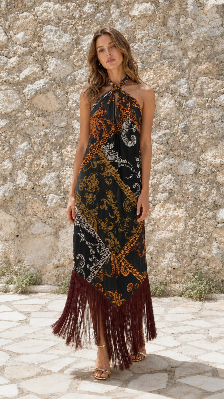 Front view of model wearing Black paisley halter fringe maxi dress