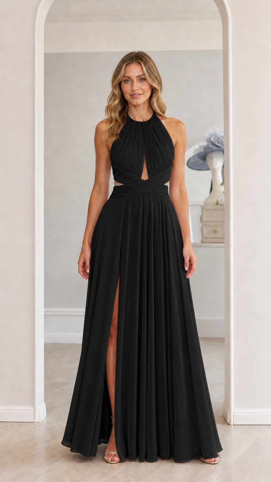Model wearing black chiffon halter maxi dress with front slit