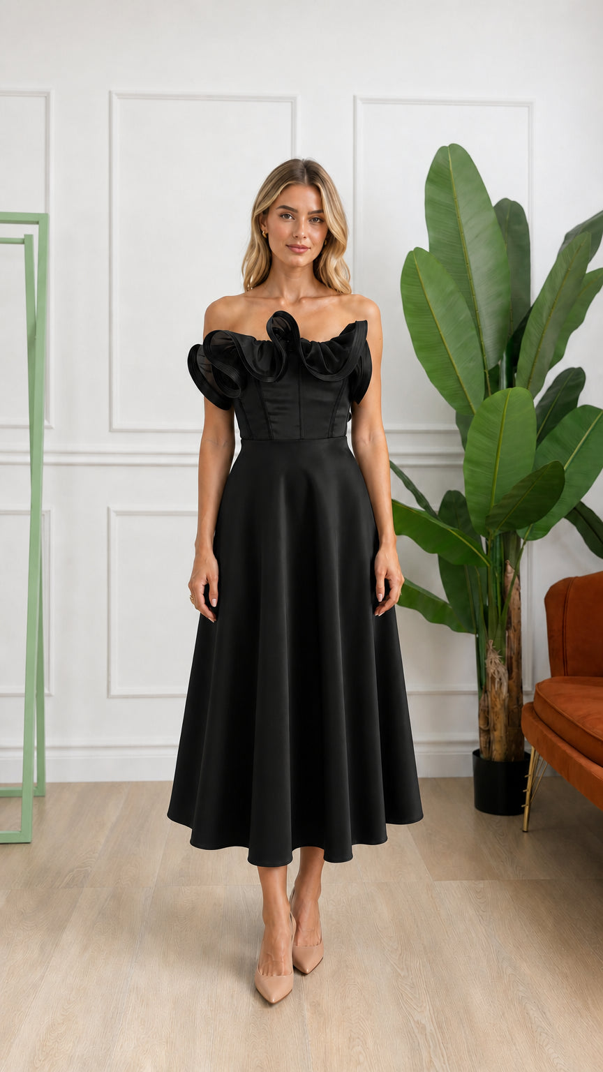 Front view of woman wearing black off-shoulder ruffle corset midi dress