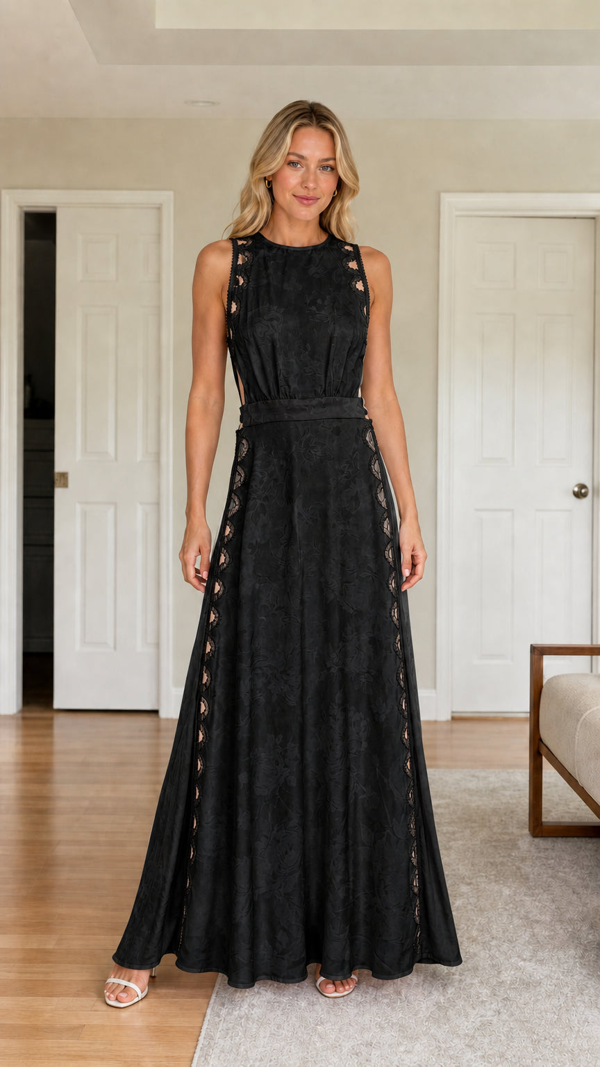Front view of woman wearing black cutout maxi dress