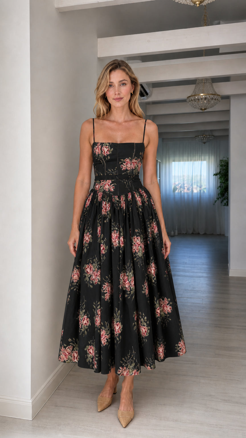 Woman wearing black floral midi dress