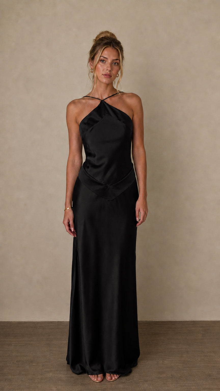 Front view of black satin halter maxi dress on model