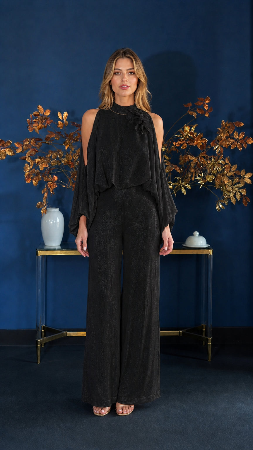 Front view of model wearing black cold-shoulder jumpsuit