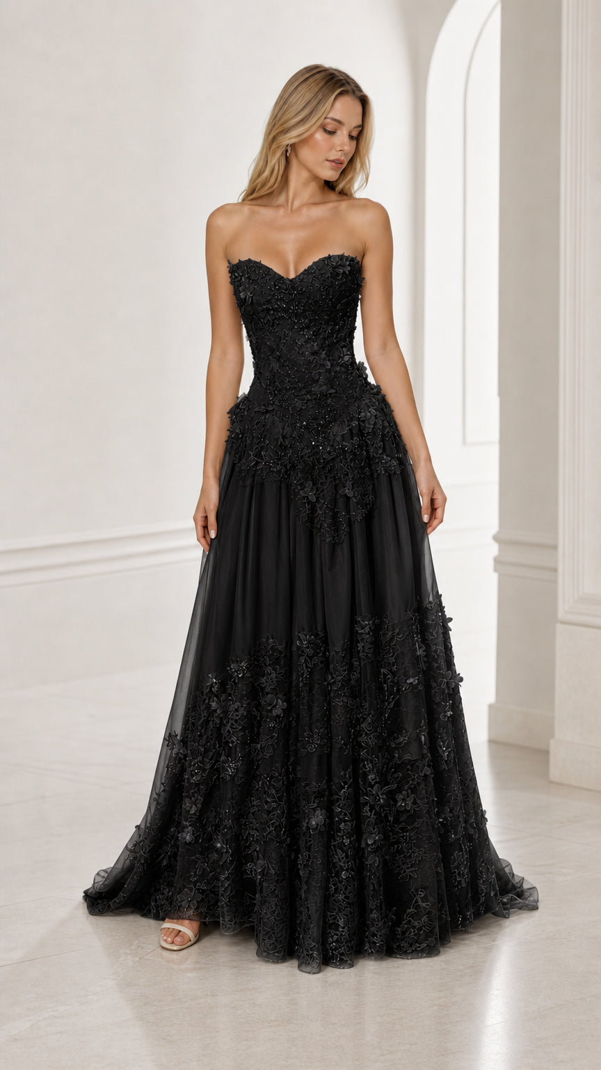Front view of black strapless floral applique ball gown