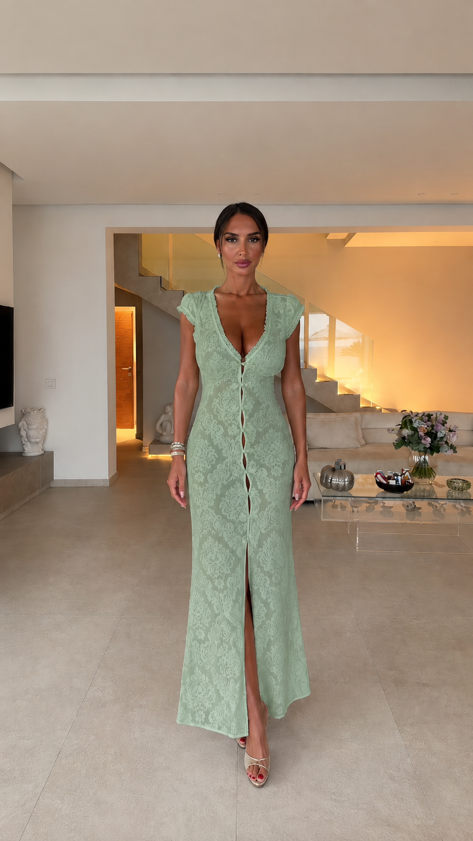Model wearing sage green lace maxi dress, front view