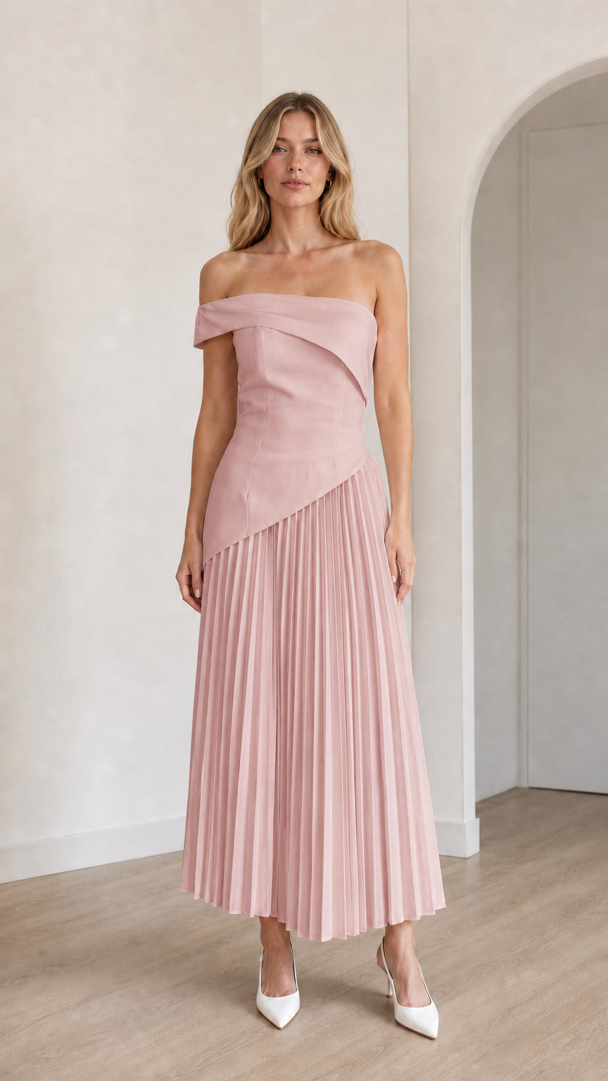 Model wearing pink off-shoulder asymmetric pleated midi dress