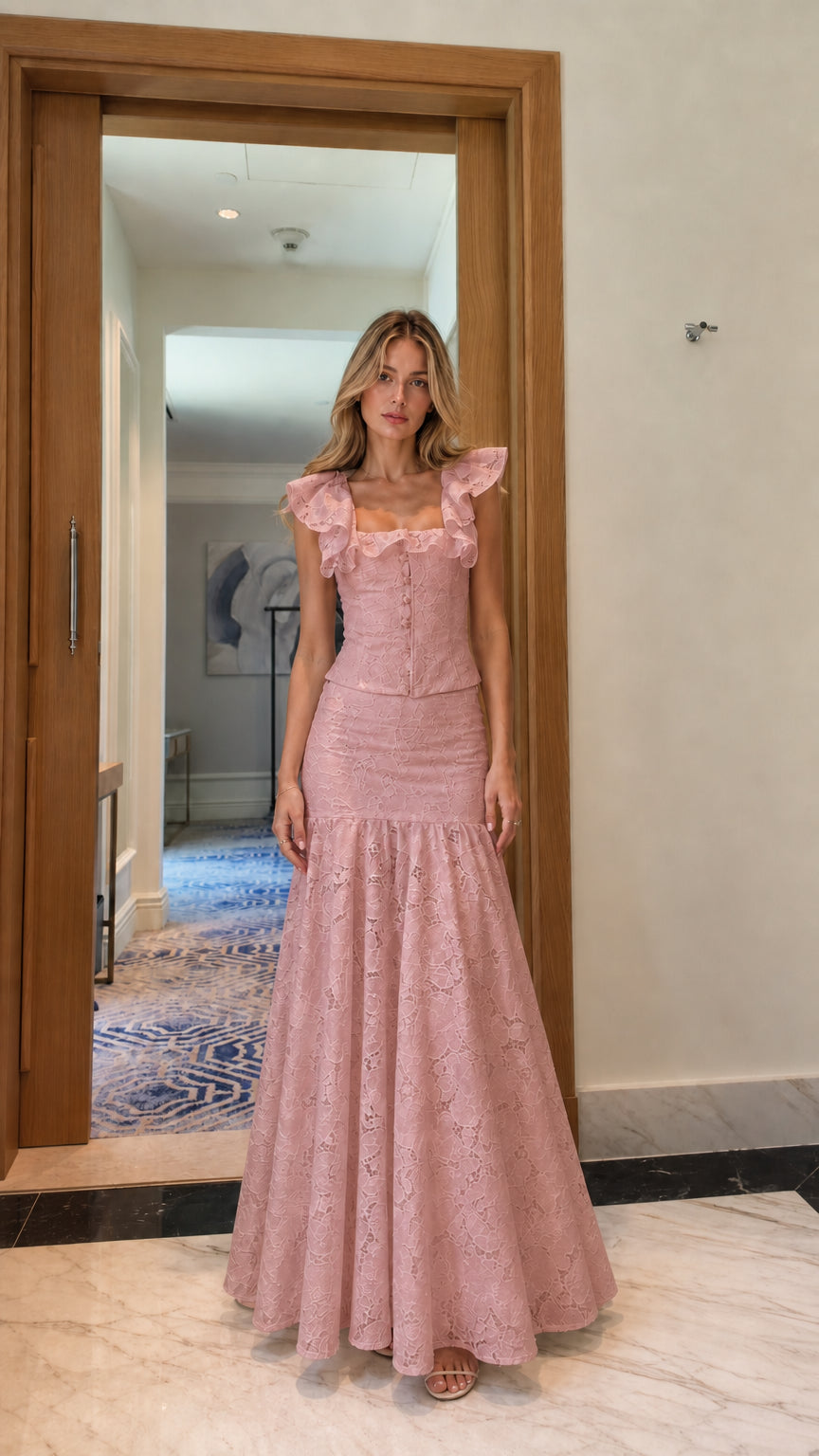 Model wearing pink lace crop top and mermaid maxi skirt set