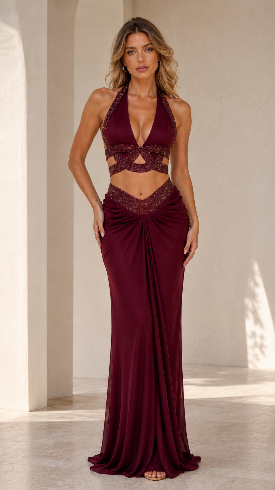 Model wearing burgundy two-piece set
