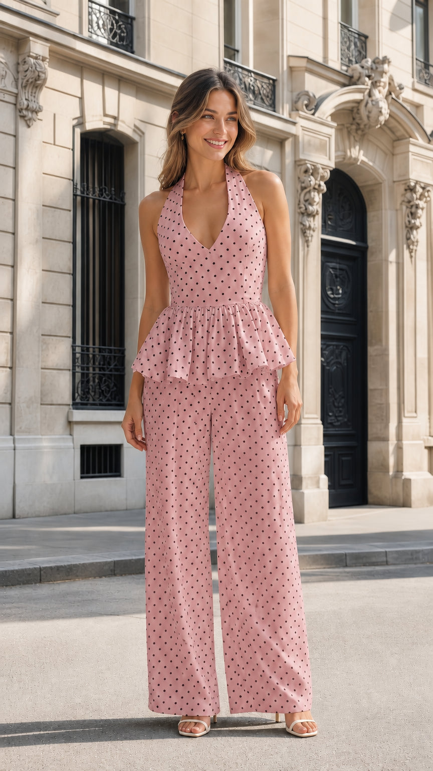 Front view of pink polka dot halter peplum jumpsuit