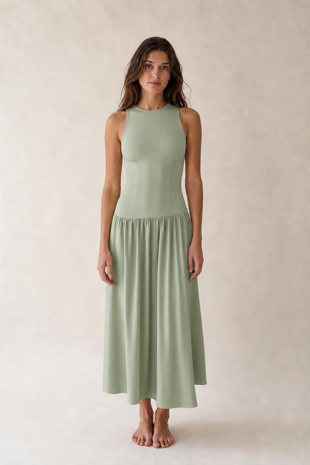 Front view of woman wearing Sage Green sleeveless midi dress