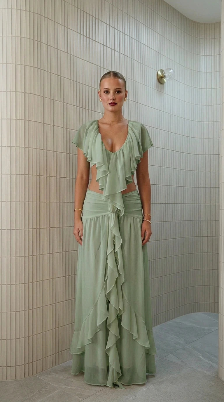 Front view of model wearing sage green ruffled two-piece maxi set