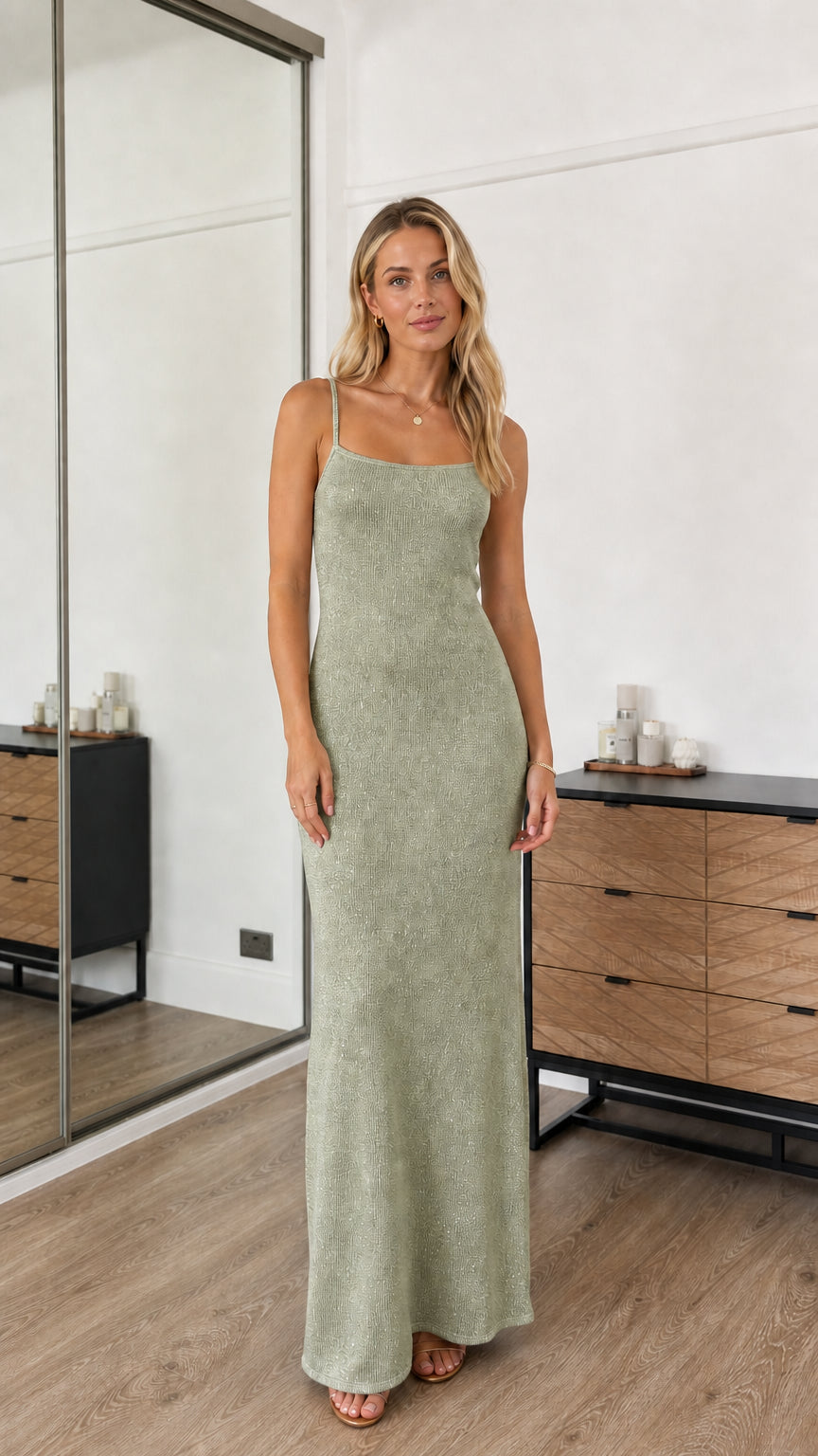 Model wearing sage green sequin spaghetti strap maxi dress