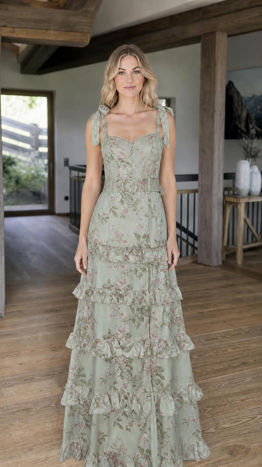 Model wearing sage green floral print tiered maxi dress