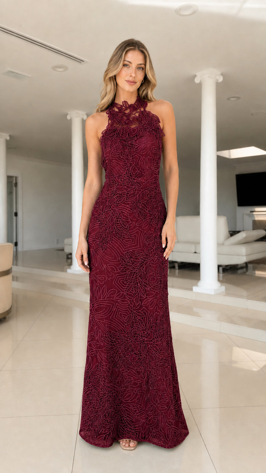 Front view of model wearing burgundy embroidered halter maxi dress