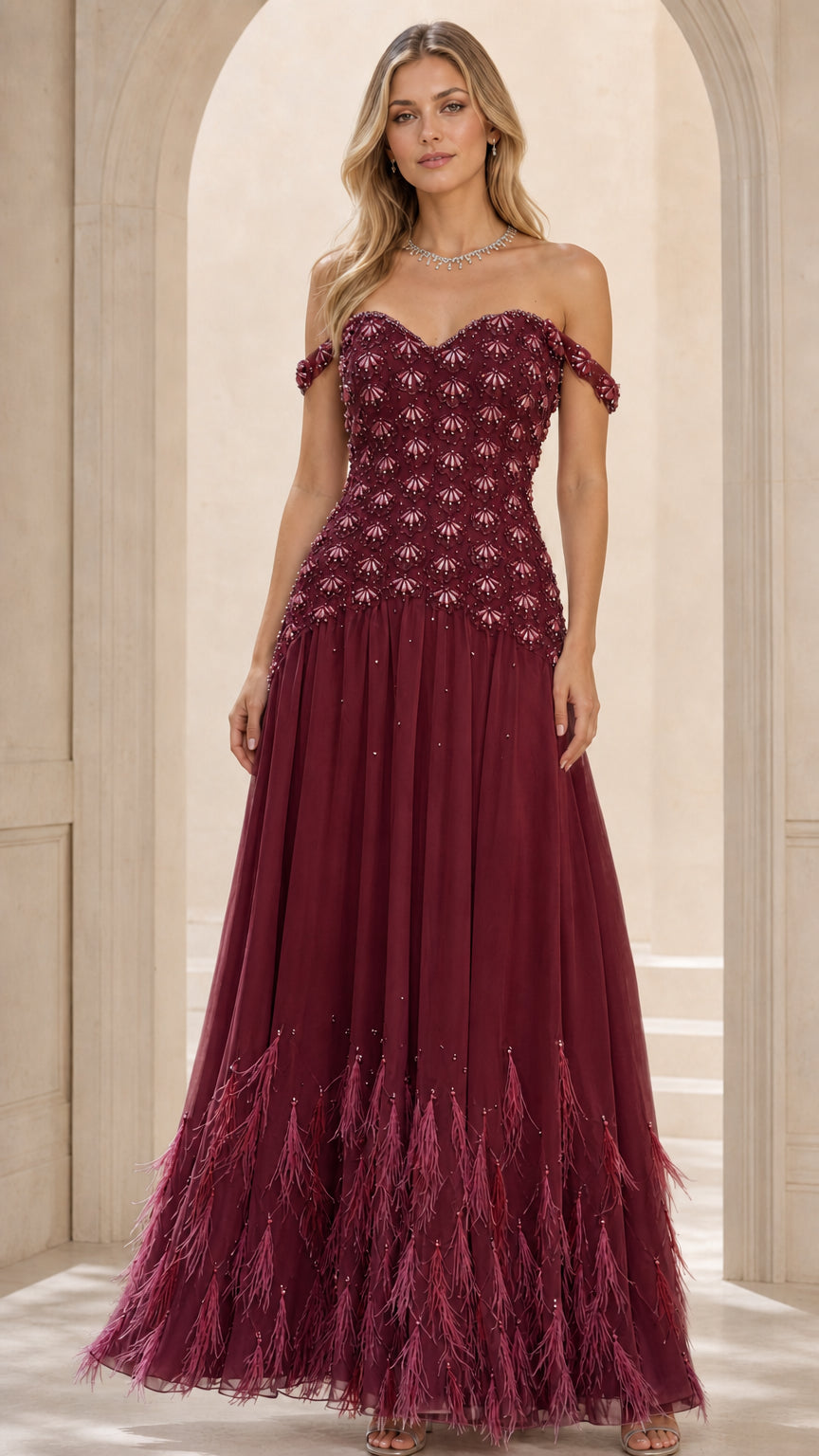 Front view of burgundy evening gown with feathered hem