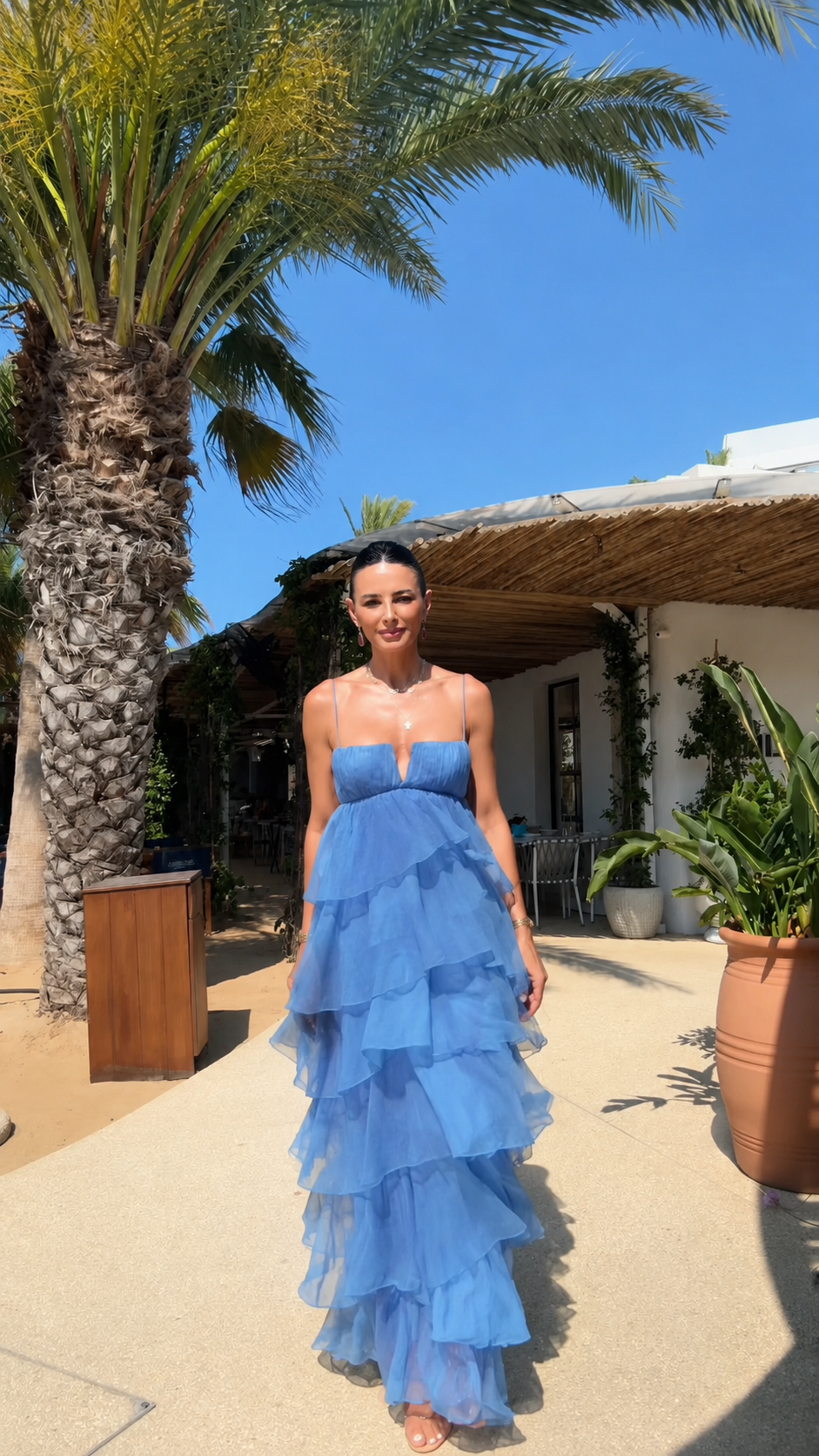 Front view of strapless tiered ruffle maxi dress in dusty blue