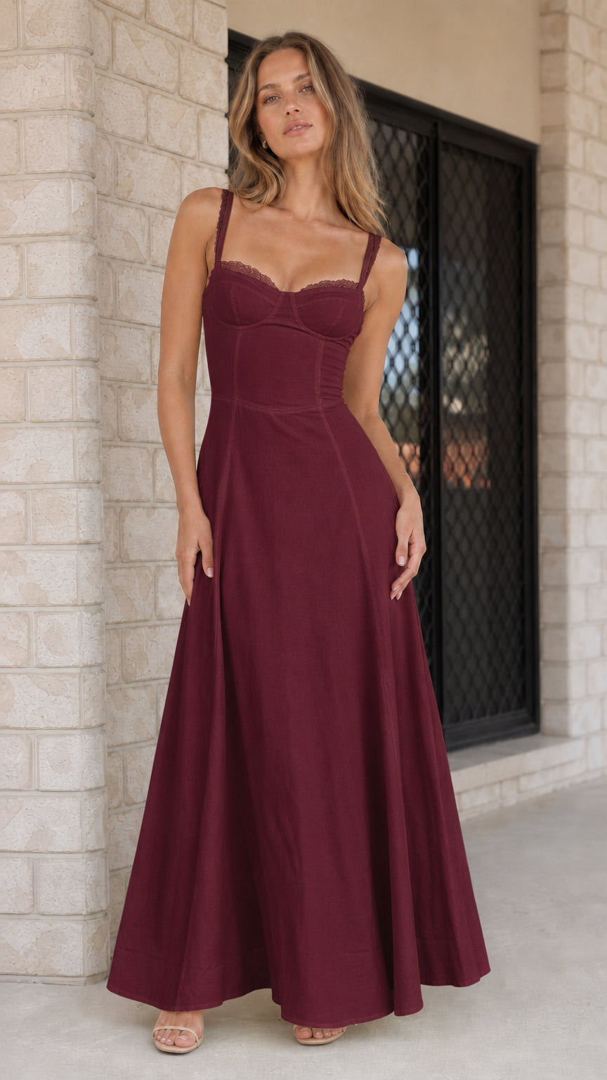 Woman wearing deep burgundy evening maxi dress