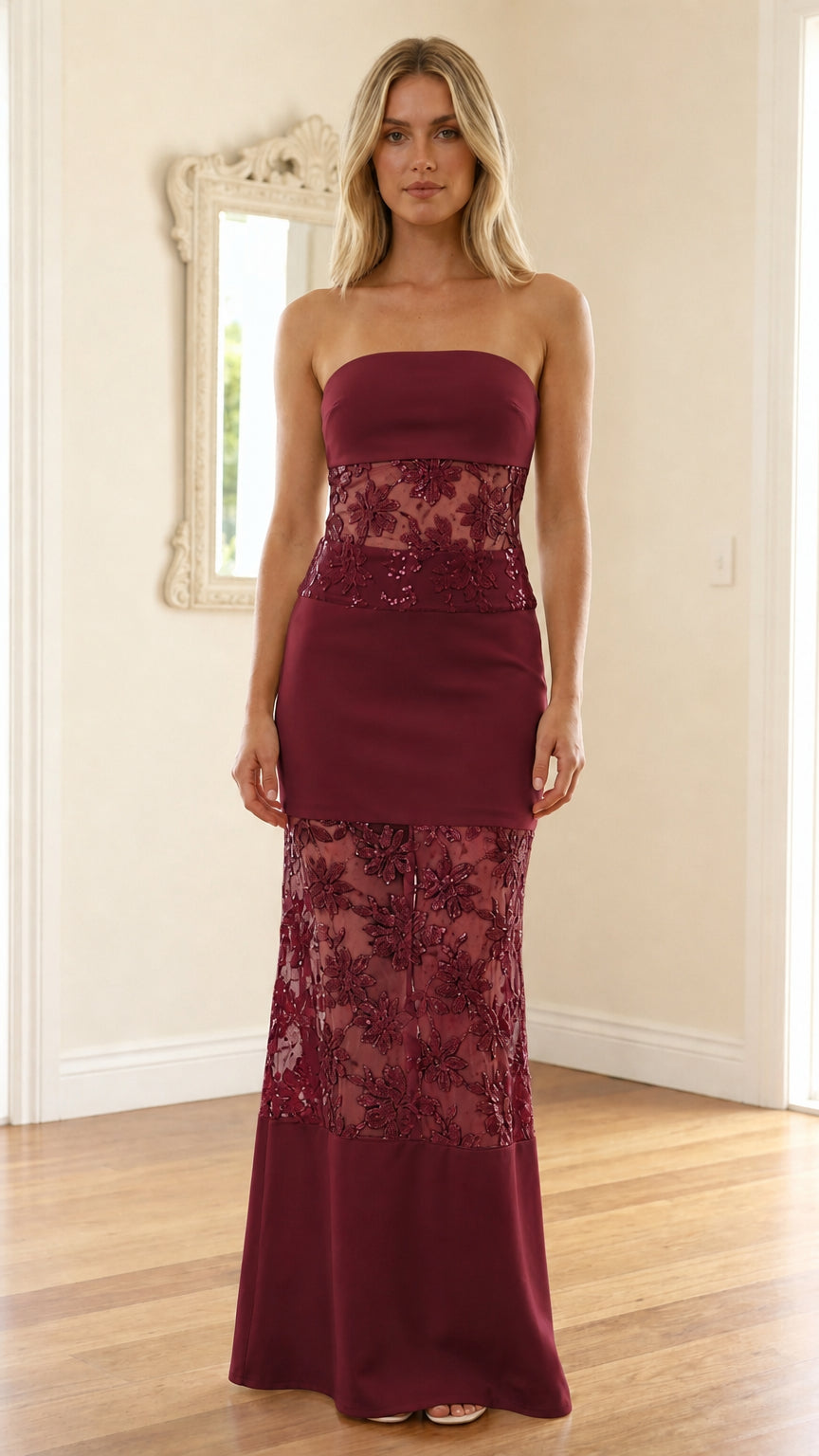 Model wearing burgundy strapless sequin mesh maxi dress