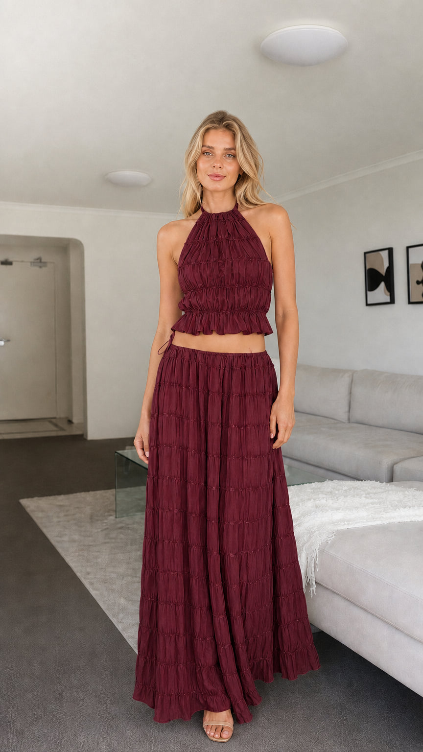 Model wearing burgundy two-piece set