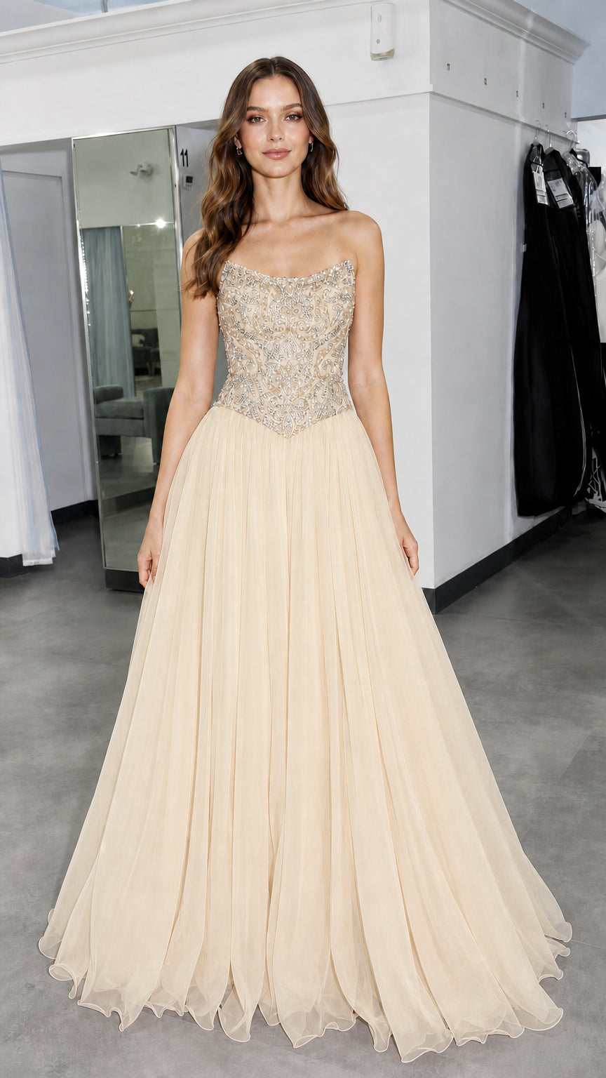 Front view of model wearing champagne formal gown