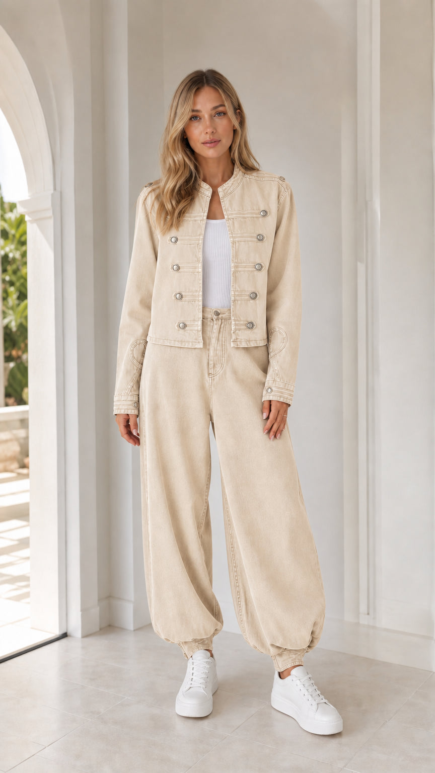 Front full view of woman wearing beige utility jacket and matching pants