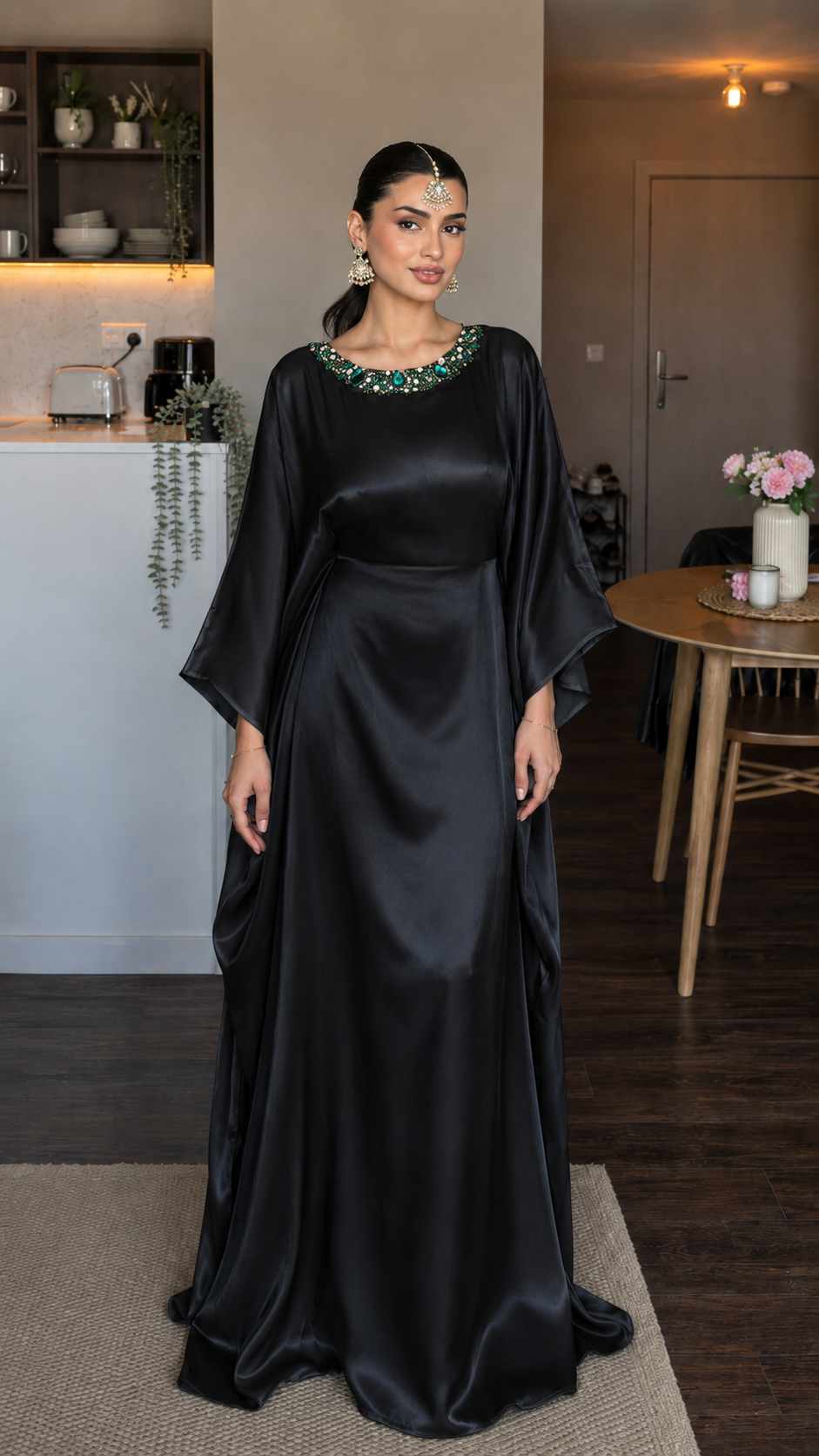 Front view of black satin-look maxi dress with embellished neckline and kaftan sleeves